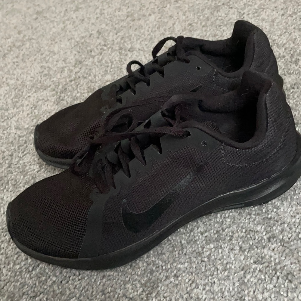 All black Nike shoes